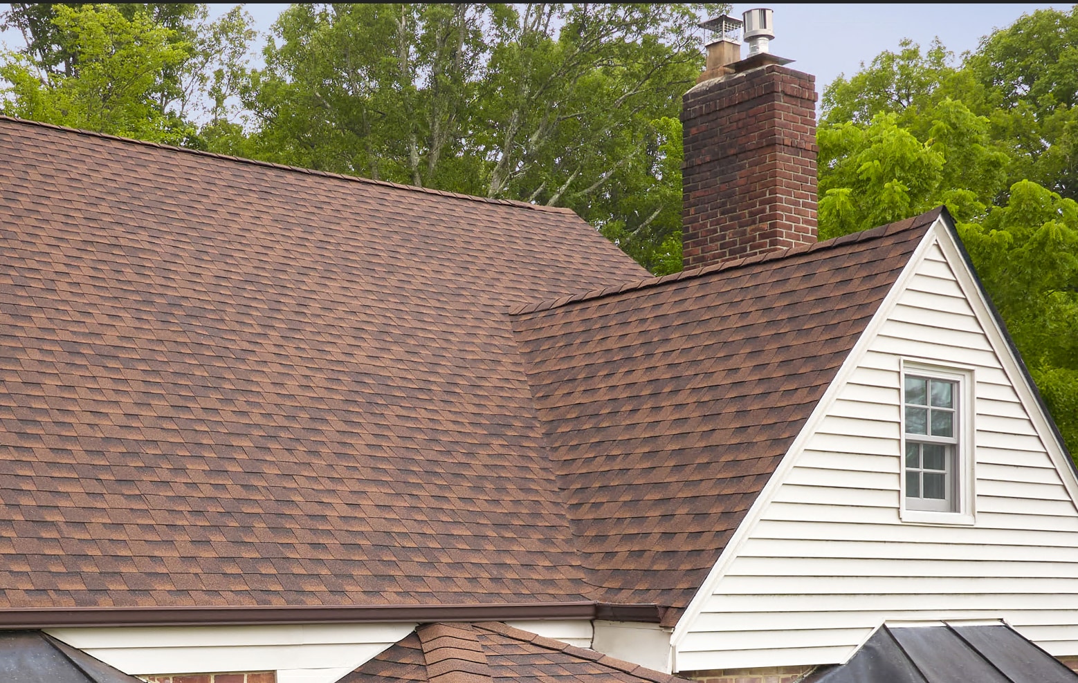 A brown asphalt roof with roof valley.